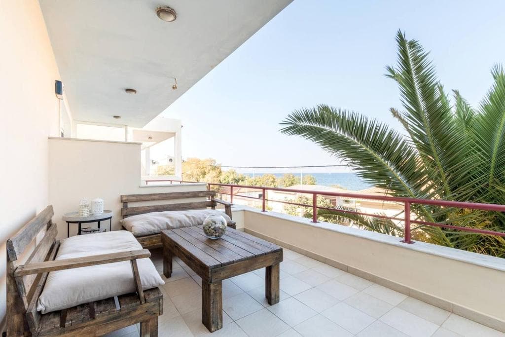 Private balcony with sea view at a Surf Apartments Artemida beachfront apartment