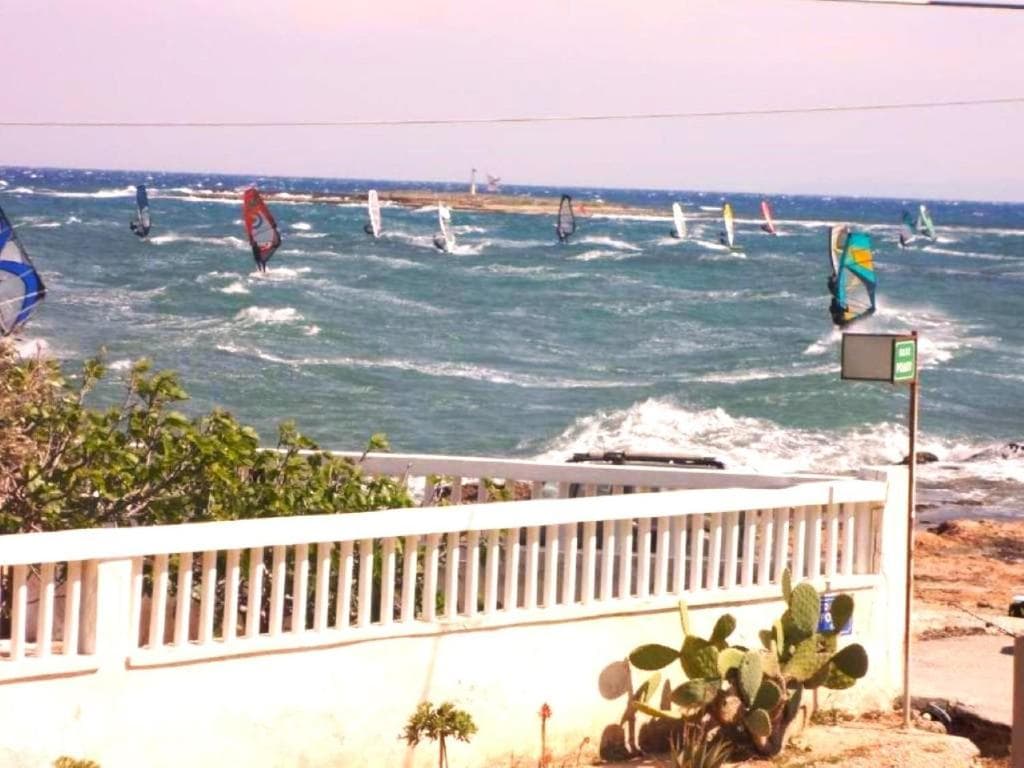 Windsurfers on the water at the Artemida windsurfing spot near Athens